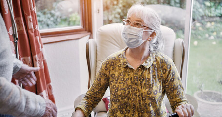 Senior, woman and living room or mask virus for protection or husband, compliance for health care....