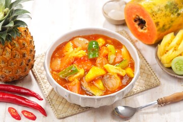 Rujak kweni or rujak aceh is a type of typical Acehnese rujak made from mashed kweni mango with chili, sugar, salt and tamarind juice.