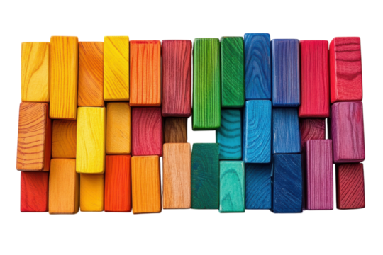 Rainbow of colorful wooden blocks arranged in a vibrant pattern on white background