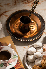Turkish coffee with traditional sweets on antique carpet
