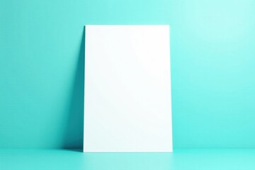 Naklejka premium Blank Vertical White Panel Against a Light Teal Background, Ideal for Mockups and Presentations
