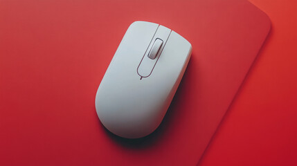 Overhead view of a white wireless mouse placed on a mouse pad