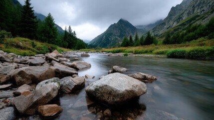 Serene mountain river flowing through lush green valley surrounded by towering peaks and dense forest