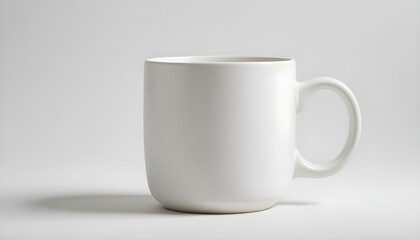 Obraz premium A pristine white ceramic mug sits against a clean white backdrop, elegantly lit and ready to be used.