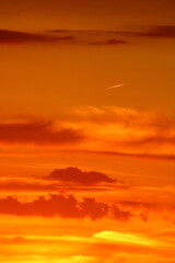 Fototapeta premium Vibrant sunset over the horizon, painting the sky with brilliant colors