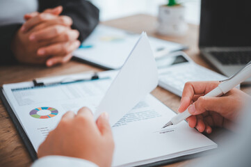 businessman is negotiating, advising, and explaining the matter of the contract to be agreed to sign the contract.
