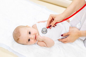 medicine, health, Pediatrics, pediatrician examines a child with a stethoscope in the clinic