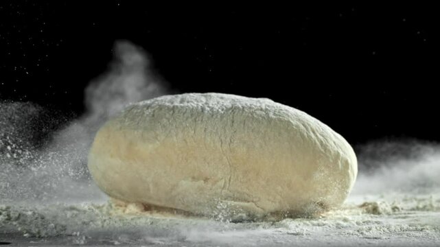 The dough falls on the table. Filmed on a high-speed camera at 1000 fps. High quality FullHD footage