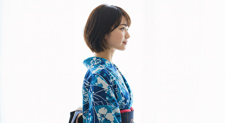 Young Woman in Blue Floral Yukata Profile Pose Against White Background