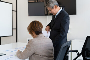 Senior businessmen analyzing data.