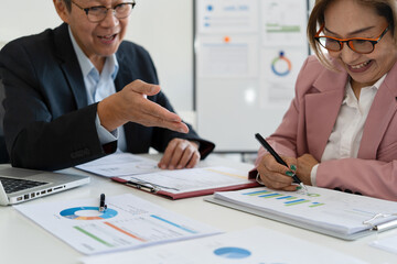 Senior businessmen analyzing data together.