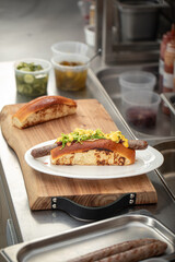 Preparing appetizing hot dogs in american diner kitchen counter