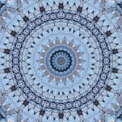 Intricate Blue Mandala with Radiating Star Patterns and Detailed Textured Layers