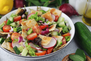A bowl with Fattoush - Traditional Levantine salad