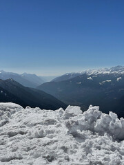The Breathtaking SnowCapped Mountains Stand Majestically Under a Clear Blue Sky Above