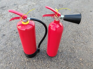 Obraz premium Fire extinguisher, Red color fire extinguisher on gray background
