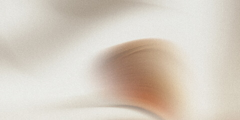 Abstract blurred background featuring soft neutral tones with a hint of brown color gradient effect