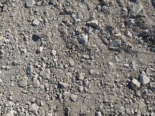 stone wall texture. photo wallpaper or background of soil with stones crushed stone