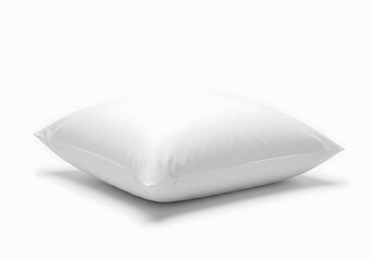 A single square white pillow resting on a white surface in a bright and clean studio setting view