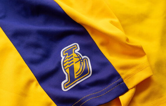 Kyiv, Ukraine, April 30, 2025.. Close-up of Los Angeles Lakers jersey showing team logo, stitched detail, and textured yellow and purple fabric.