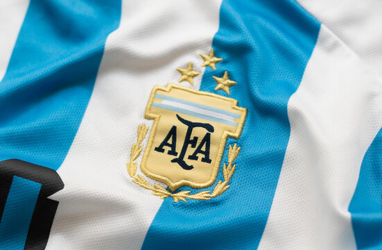 Kyiv, Ukraine, April 30, 2025. Close-up of Argentina national football team badge with three stars on blue and white striped jersey fabric.