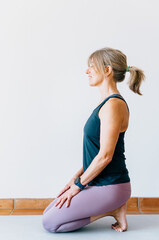 Woman seated on heels in broken toe yoga pose for post-run recovery