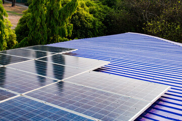 Solar panels with visible dirt and dust mounted on a rooftop. Represents the importance of maintenance for sustainable and efficient renewable energy usage.