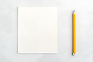 Blank page and yellow pencil on clean surface, ready for ideas, sketching, or notes. Workspace with potential for creativity or productivity.