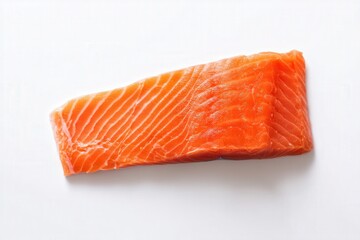 Raw salmon fillet on white background, fresh orange seafood with visible texture
