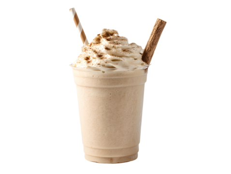Creamy beverage topped with whipped cream and cinnamon sticks in a clear plastic cup with straw