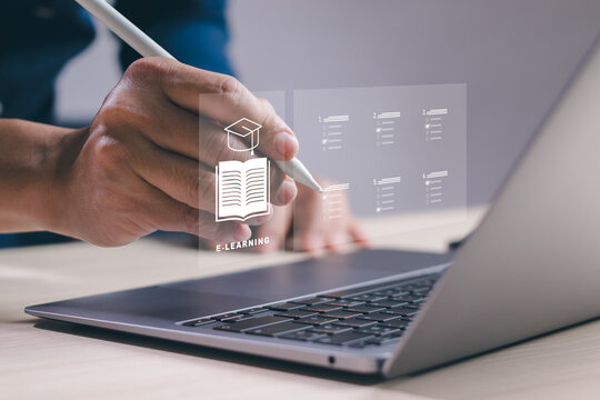 Concept of online education course or distance learning with wireless internet technology, man hand holding pen doing test or learning assessment on computer with graduation cap on virtual screen