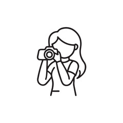 A photographer person with a camera lens is looking, holding professional photography equipment