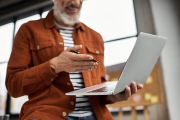 Engaging in an important discussion at the modern office workspace with a laptop and pen