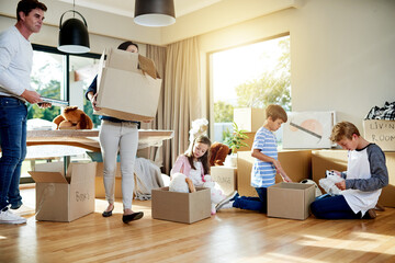 Unpacking, family and parents with children, boxes and milestone with new home, moving and real estate. Property, ownership and people with kids in living room, love and investment with mortgage