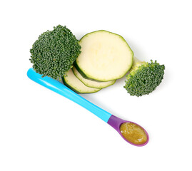 Baby food. Tasty puree in spoon, zucchini and broccoli isolated on white, top view