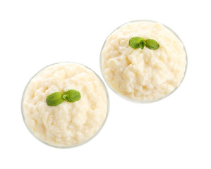 Delicious rice pudding with mint in glass dessert bowls isolated on white, top view