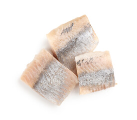 Pieces of delicious herring isolated on white, top view