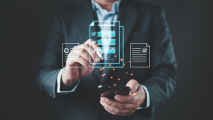 A businessman uses a stylus and smartphone to complete a digital document with a glowing...