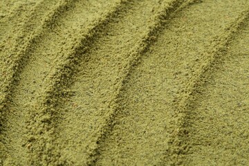 Superfood. Green onion powder as background, closeup