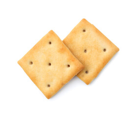 Tasty salty crackers isolated on white, top view