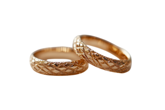 Elegant gold wedding bands intricate design symbol of love and commitment softly lit close up view