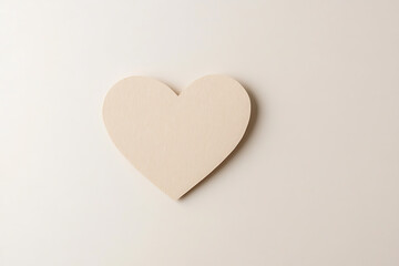 Neutral heart cutout on a soft beige backdrop. Symbol of love, kindness, and connection. Minimalist, delicate, and evokes feelings of warmth.