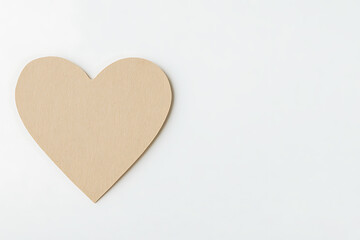Fototapeta premium Heart-shaped paper craft on white. A simple, handmade design suggesting love, affection, or a personal touch, emphasizing minimalism and handcrafted beauty.