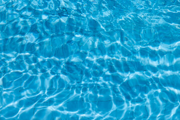 Blue Water Pool Surface with Sunlight Reflections
