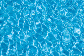 Obraz premium Blue Water Pool Surface with Sunlight Reflections