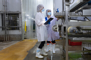 Quality control inspectors in a food processing plant