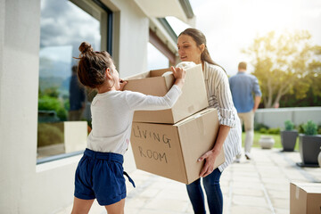Mother, girl and helping with boxes at new house for property investment, relocation support and security. Real estate, woman and child with teamwork for moving in, mortgage milestone and fresh start