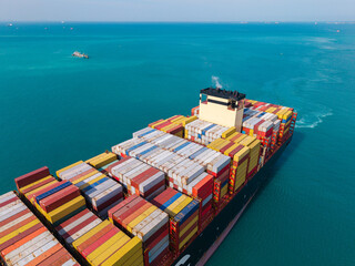 Large cargo ship transporting colorful containers across ocean