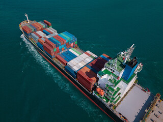 Large cargo ship transporting colorful containers across ocean