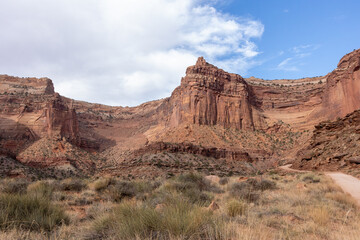 Fototapeta premium One of Moab’s most iconic dirt roads, Shafer Trail winds through red rock canyons and remote landscapes